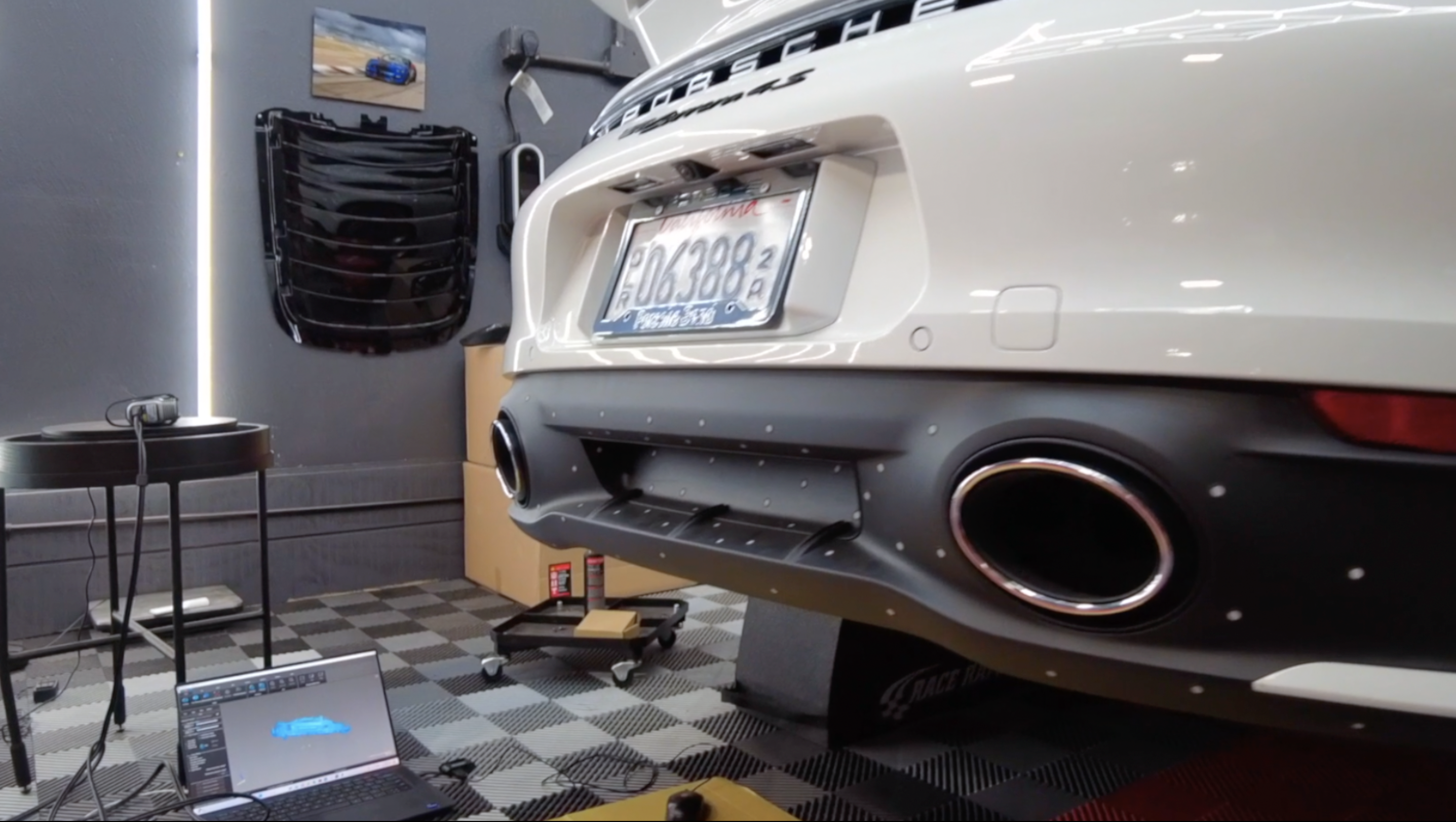 A porsche, a 3D scanner, and a laptop computer